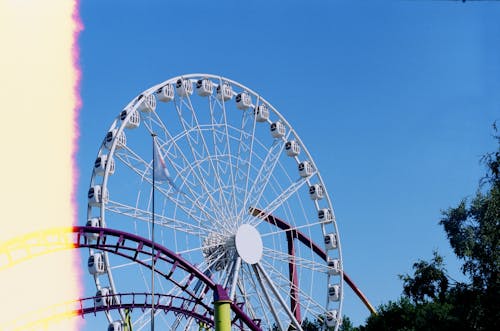 White Ferris Wheel Under Blue Sky