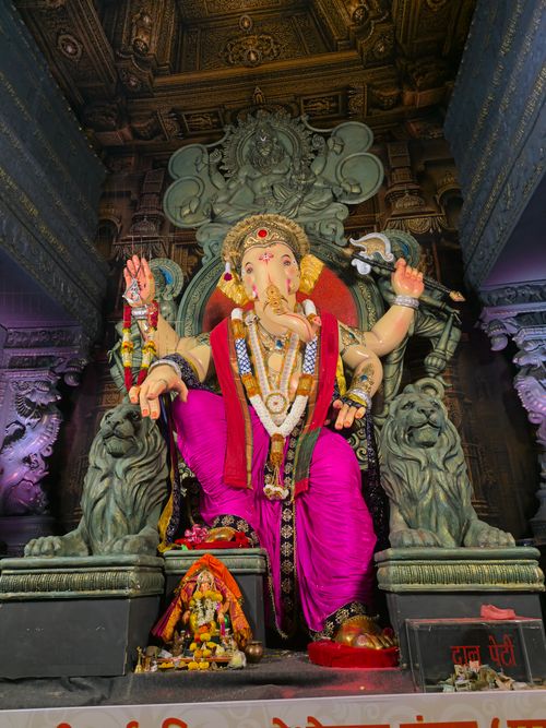 Free A vibrant Lord Ganesha statue with intricate details inside a temple. Stock Photo