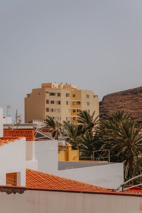 Free Rooftops and palm trees in San Sebastián de La Gomera, Canary Islands, Spain. Stock Photo