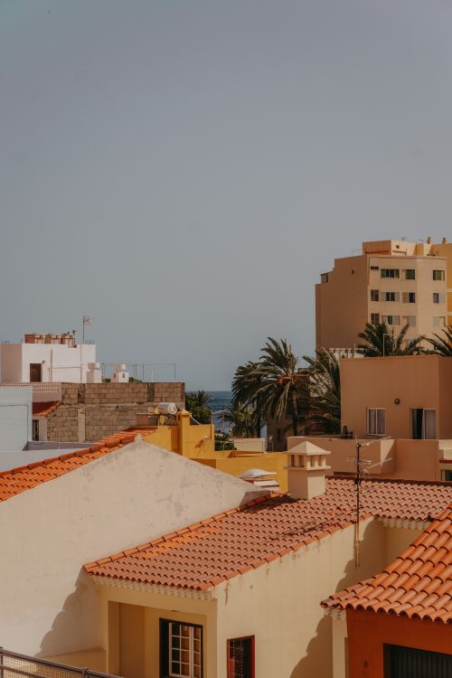 Free Vibrant rooftops overlook the coast in San Sebastián de La Gomera, Canary Islands. Stock Photo