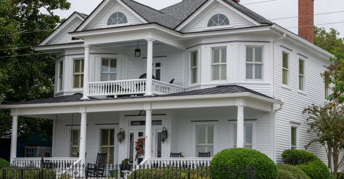 Beautiful white Southern house with porch in Beaufort, North Carolina.