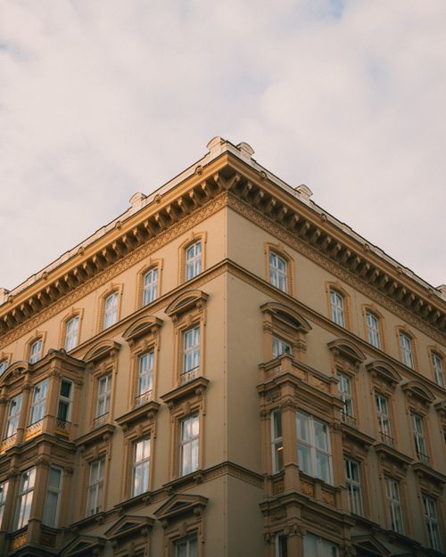 Free Stately historic Viennese building captured at sunrise, featuring classic European architecture. Stock Photo