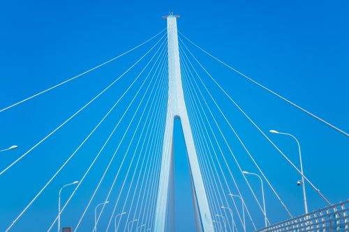 Free Stunning view of a suspension bridge with clear blue skies and geometric design elements. Stock Photo