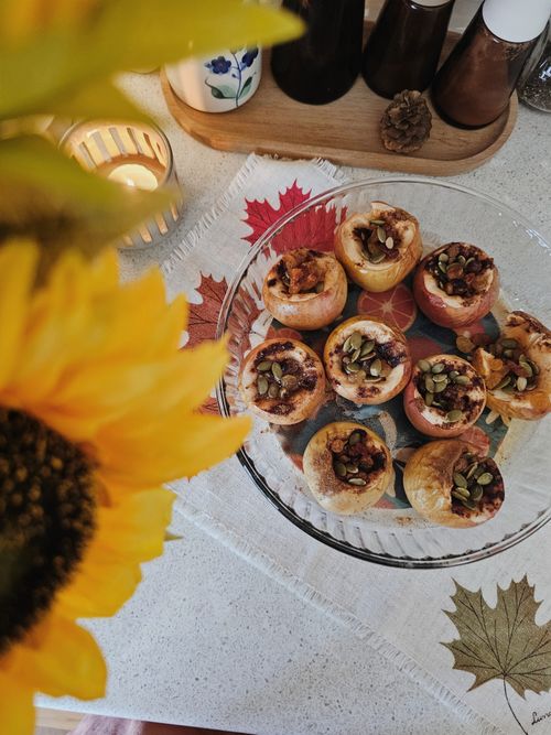 Free Delicious baked apples garnished with seeds, evoking a cozy autumn vibe. Stock Photo
