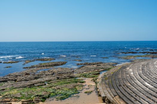 Panoramic view of rocky coastline and ocean from Porto, Portugal on a clear day.