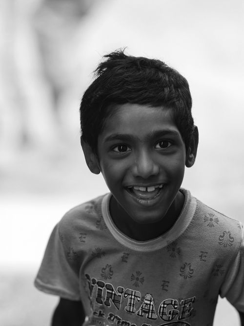 Free Captivating monochrome portrait of a smiling child, capturing pure joy and innocence. Stock Photo