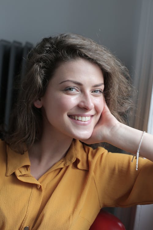 Woman in Yellow Button Up Shirt Smiling