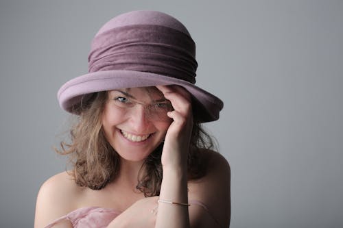 Smiling Woman Wearing Purple Hat
