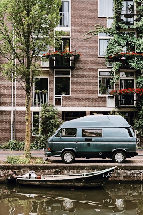 Van Parked in Front of Brown Brick Building