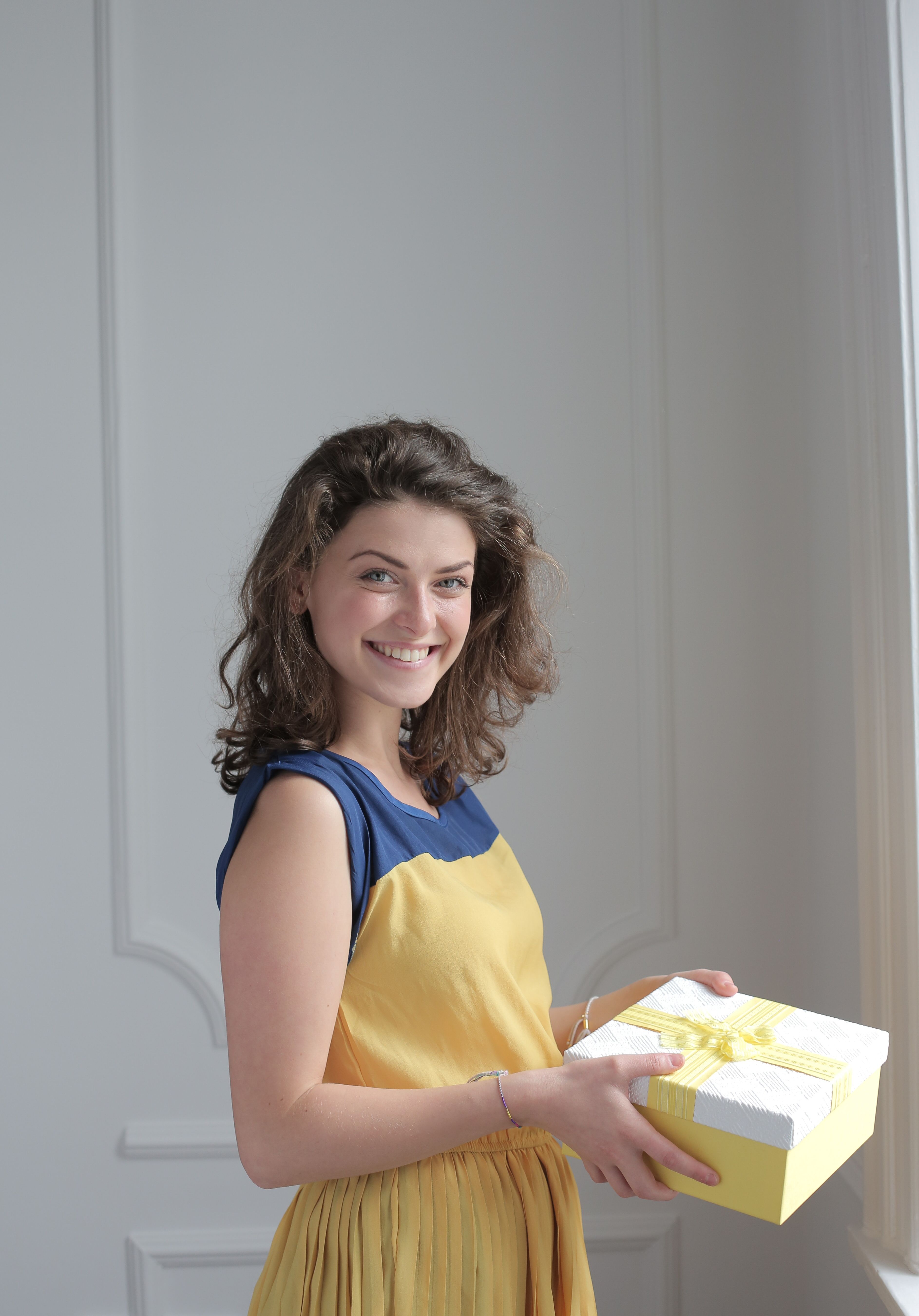 Woman Holding a Gift · Free Stock Photo