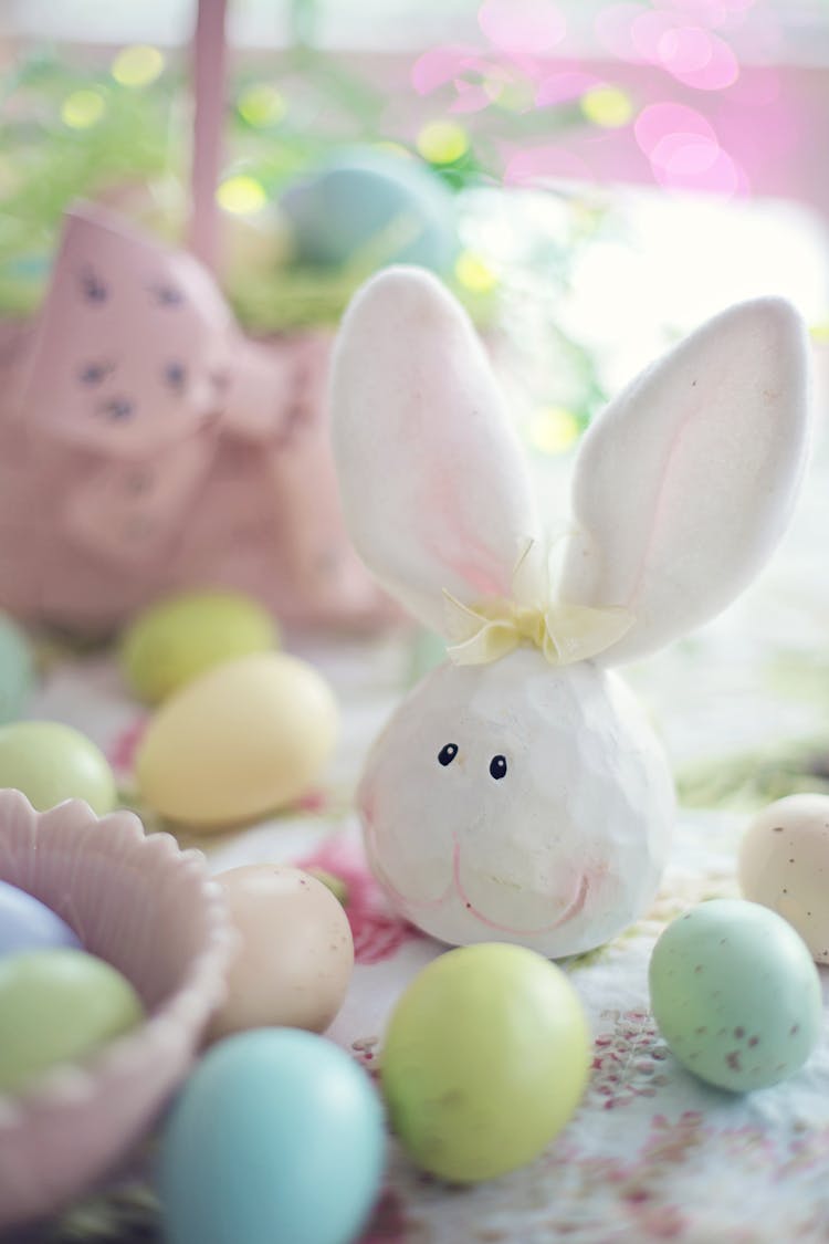 White Rabbit Figurine Beside Easter Eggs