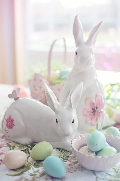 White Rabbit Figurine Beside Easter Eggs on Floral Textile · Free Stock  Photo
