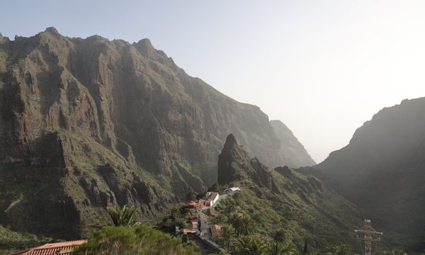 Discover the breathtaking views of Tenerife's Masca Valley with towering rocky cliffs.