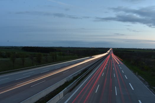 Long exposure of light trails on a highway at twilight near Lützen, Germany.