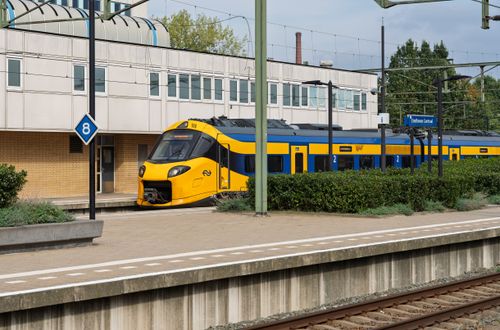 Free A sleek, modern train at Eindhoven Centraal Station, Holland, showcasing Dutch transport architecture. Stock Photo