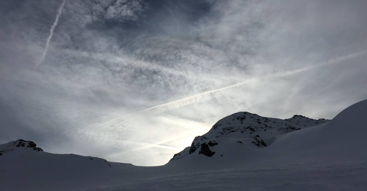 Free stock photo of cloud formation, evening sun, mountain peak