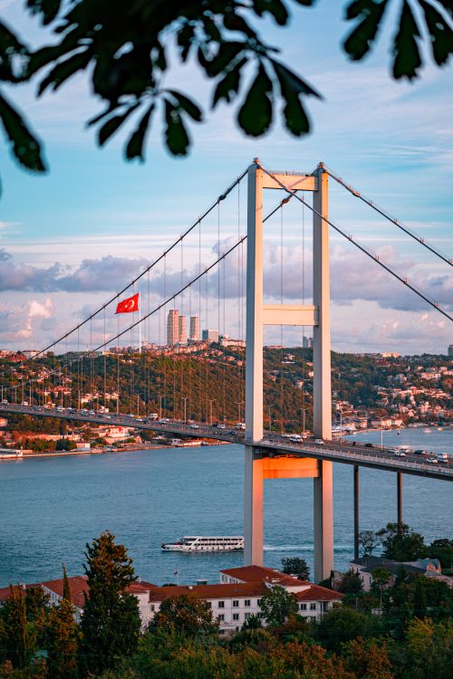 Free Scenic view of the Bosphorus Bridge in Istanbul with a colorful sunset backdrop. Stock Photo