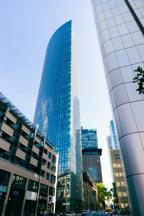 Free A striking modern skyscraper under clear skies in central Frankfurt, Germany, showcasing contemporary architecture. Stock Photo