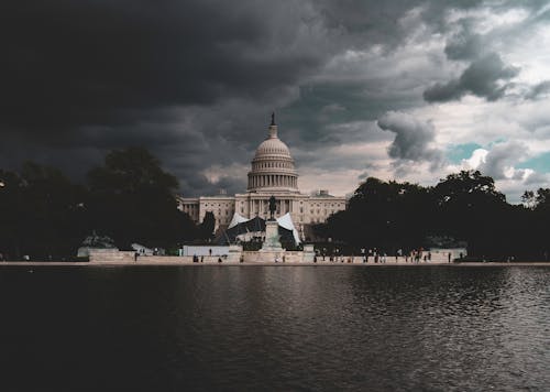 Dome Building Near Body Of Water Under Cloudy Sky