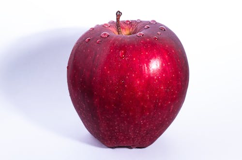 Free Selective Focus Photo of Delicious Red Apple Fruit With White Background Stock Photo