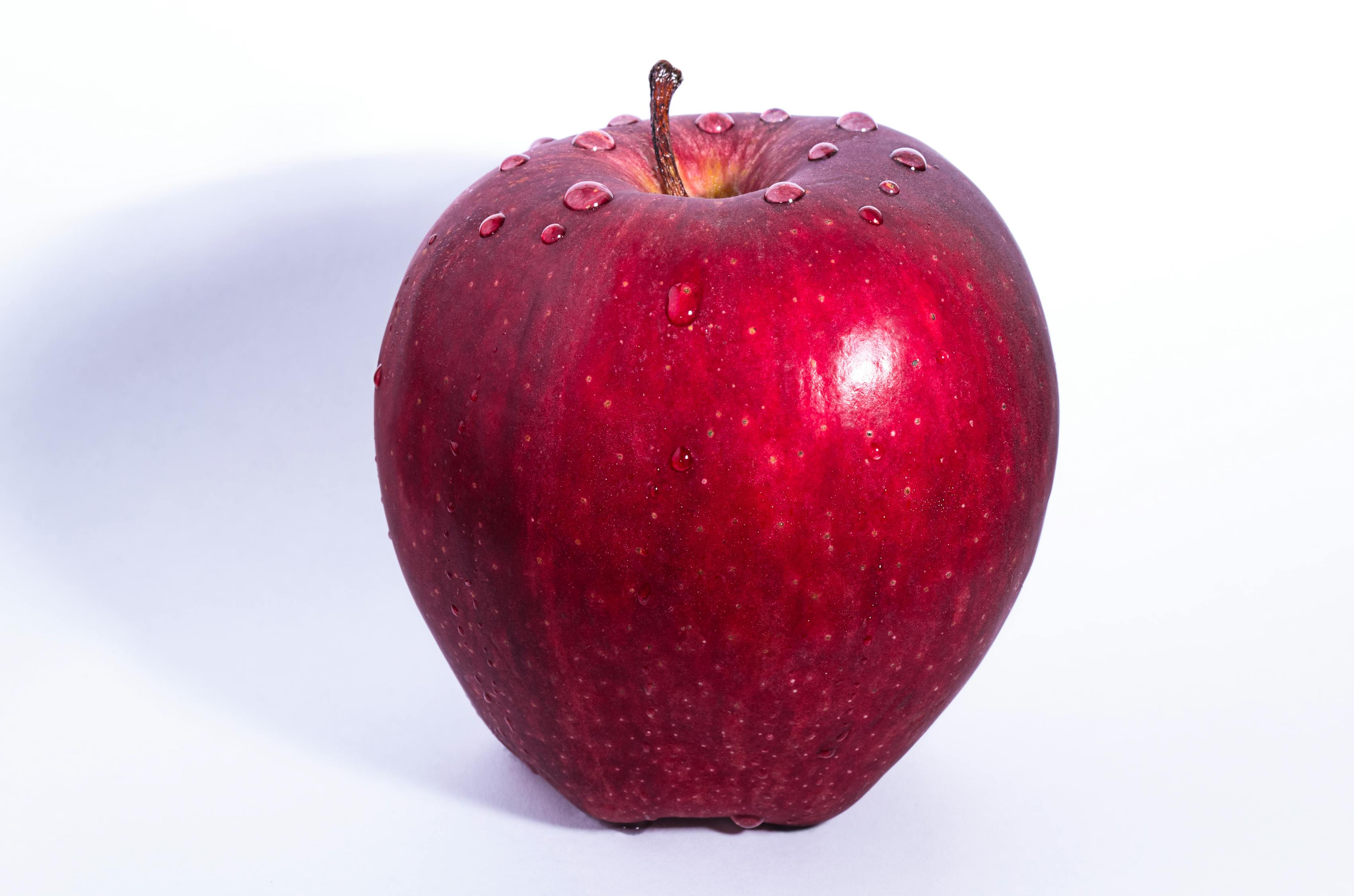 selective-focus-photo-of-delicious-red-apple-fruit-with-white