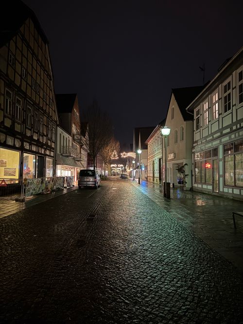 Free A peaceful, cobblestone street illuminated at night in Germany. Stock Photo
