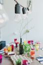 Glasses with coloring liquids and immersed eggs for Easter
