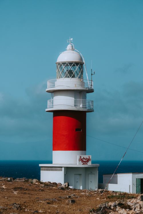 Free Scenic view of the red and white lighthouse at San Sebastián de La Gomera, Canary Islands. Stock Photo
