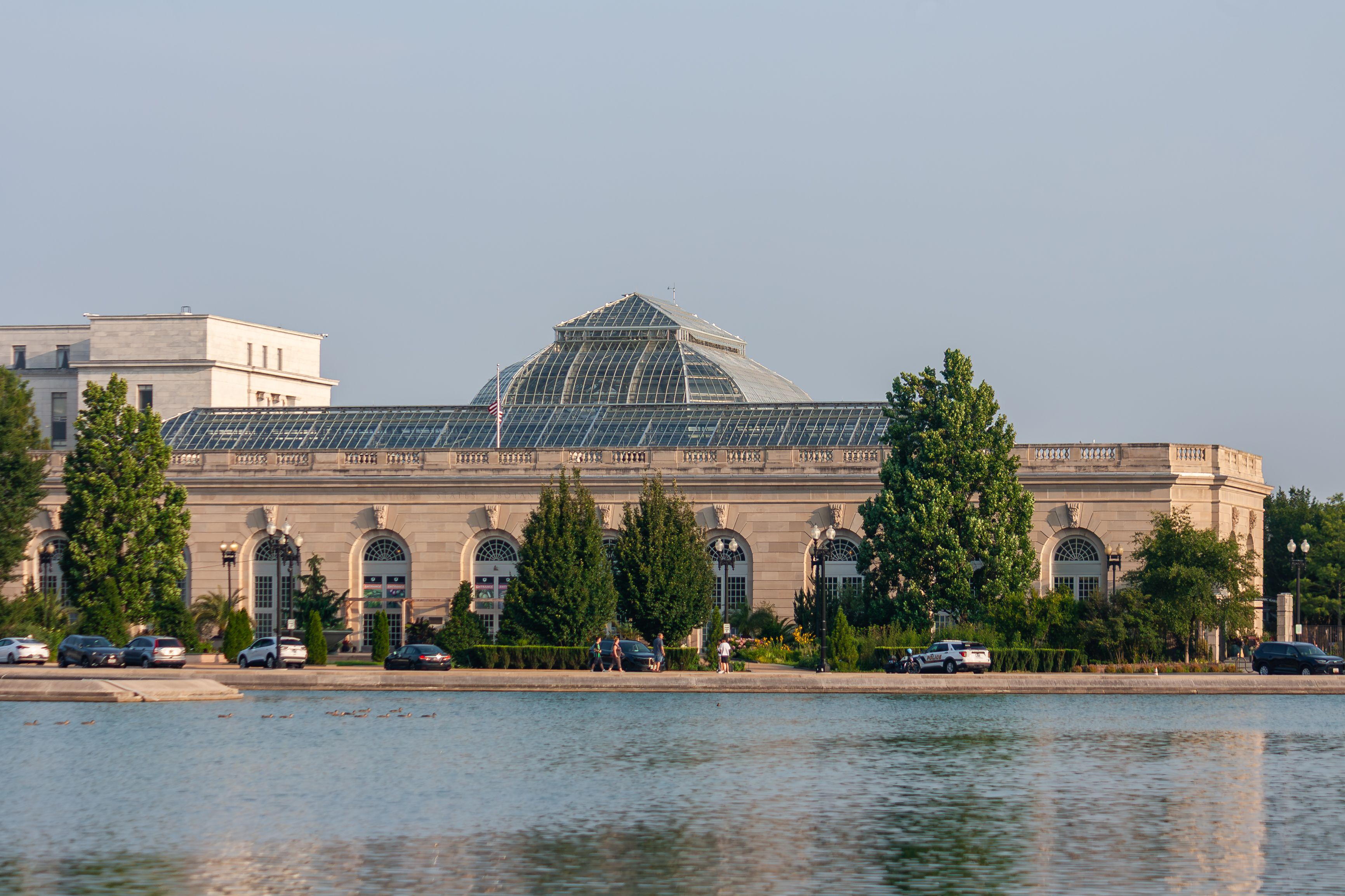 Scenic view of the United States Botanic Garden in Washington D.C. by a reflecting pool.