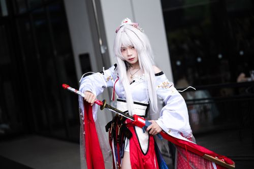Free Portrait of an individual in vibrant cosplay attire with a traditional samurai sword, capturing dynamic expression. Stock Photo