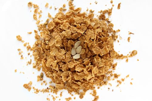 Free High-angle view of corn flakes with almond slices on a white background. Stock Photo