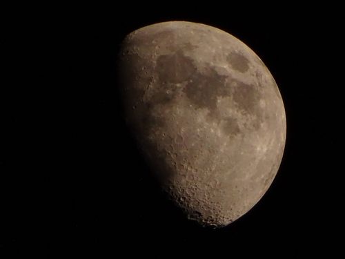 Free High-resolution photo of the moon's surface with craters, captured at night. Stock Photo
