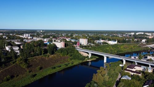Free Captivating aerial view of Rzhev, Tver Oblast, featuring a bridge over the Volga River on a clear summer day. Stock Photo