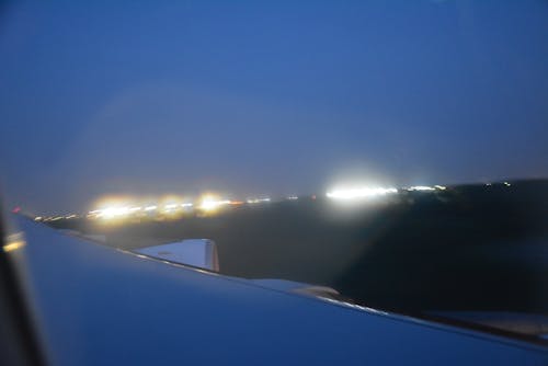 Free stock photo of airplane view, blue skies, city lights