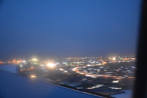 Free stock photo of airplane view, blue skies, city lights