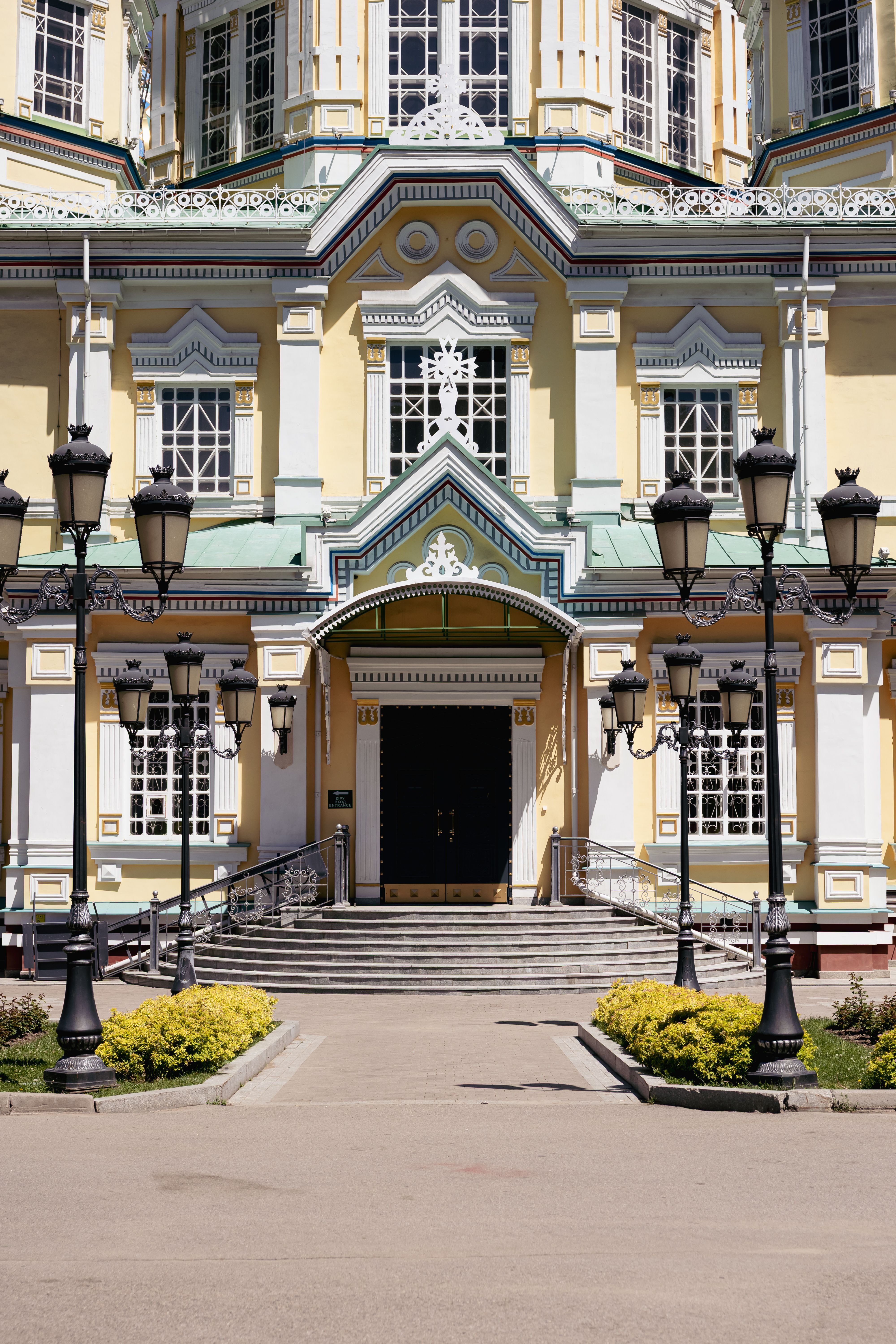 Exterior view of Zenkov Cathedral in Almaty, featuring ornate architecture and vibrant colors.