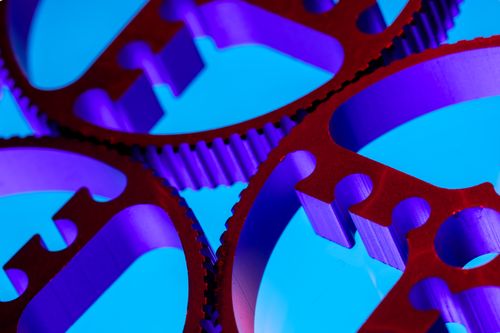 Free Close-up of vibrant blue and purple metallic gears showing industry and precision. Stock Photo