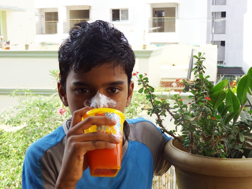 Free stock photo of boy cream on nose, boy drinking juice, cricketer drinking juice