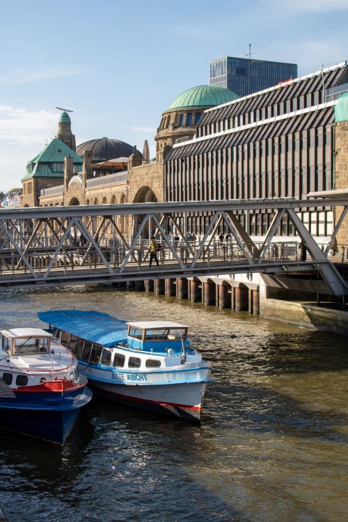 Free Explore the Hamburg port showcasing boats and historic architecture under a blue sky. Stock Photo