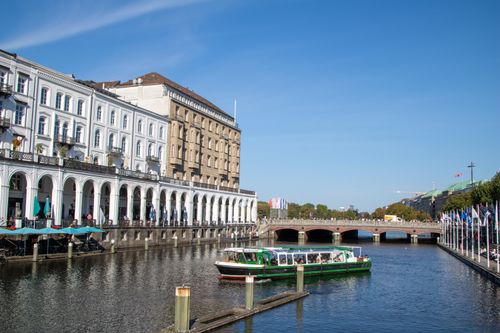 Free Charming view of Alster Canal with historic architecture and boats in Hamburg. Stock Photo