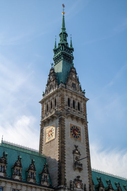 Free Stunning view of Hamburg's iconic city hall tower against a clear blue sky. Stock Photo