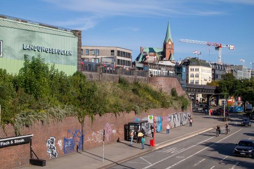 Free Explore the vibrant Landungsbrücken area in Hamburg, Germany with its iconic architecture and bustling streets. Stock Photo