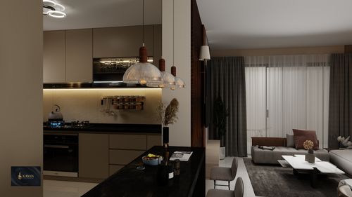 Free A stylish open-concept kitchen and living room with modern decor and soft lighting. Stock Photo