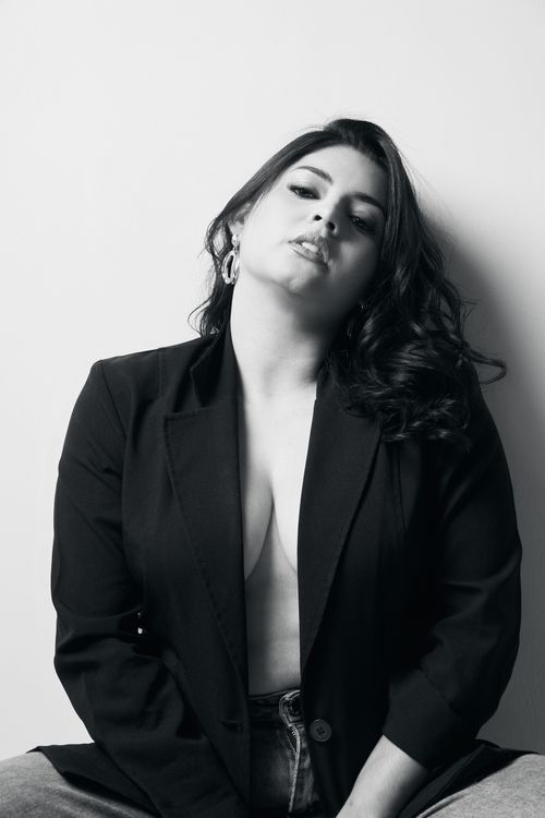 Free Black and white portrait of a woman in a blazer with confident pose and expression. Stock Photo