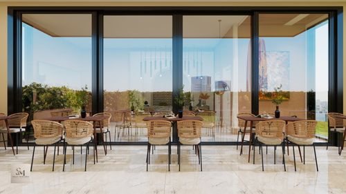 Free Chic outdoor café featuring wicker chairs and glass facade, offering a serene dining experience. Stock Photo