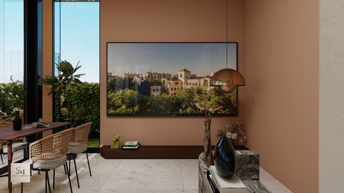 Free Stylish living room with wall art and abundant natural light. Stock Photo