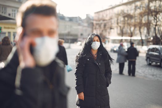 City street with people wearing face masks during pandemic.