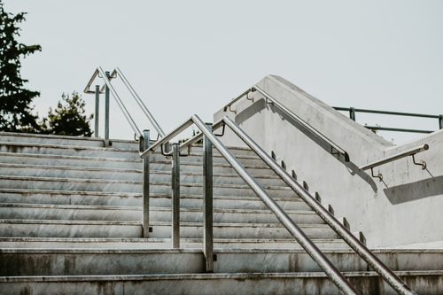 Free Concrete staircase with metal railings, showcasing urban architecture and design. Stock Photo