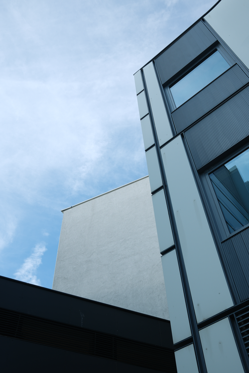 Free Elegant geometrical perspectives of modern buildings against a bright sky in Vienna, Austria. Stock Photo