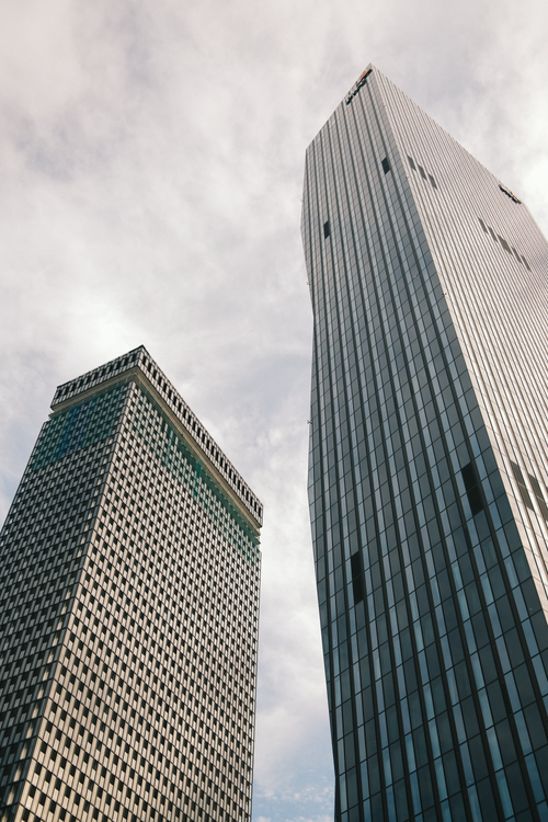 Free High angle view of contemporary skyscrapers in Wien, Austria under a cloudy sky, illustrating urban architecture. Stock Photo